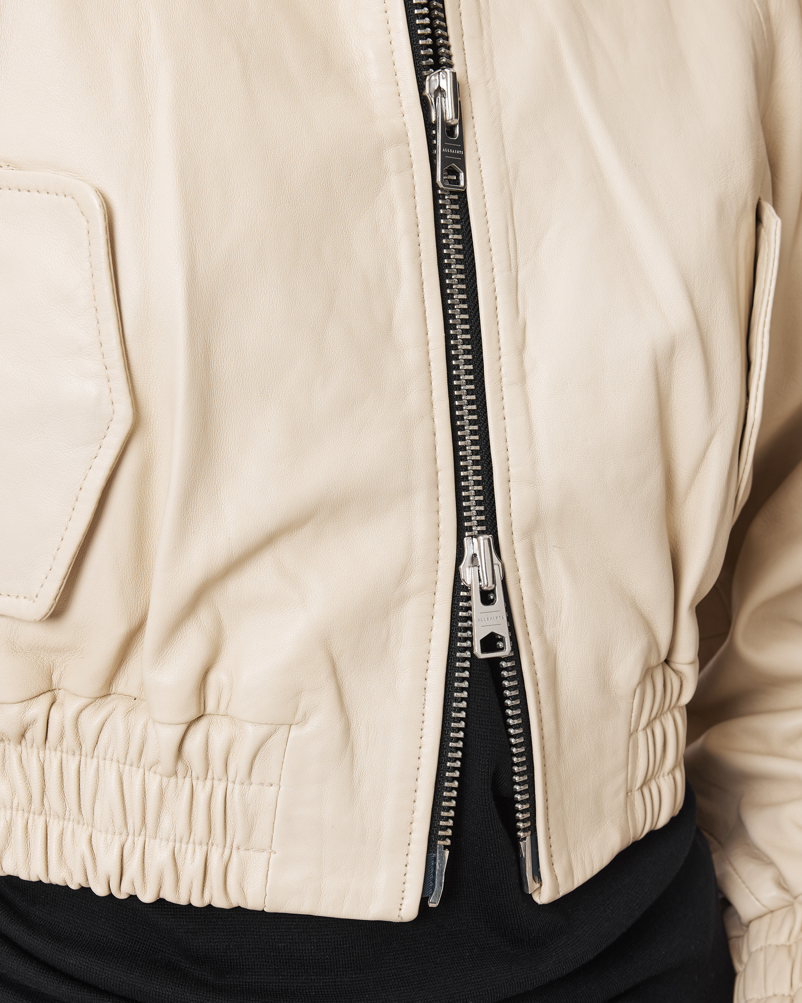 DUAL ZIP CLOSURE